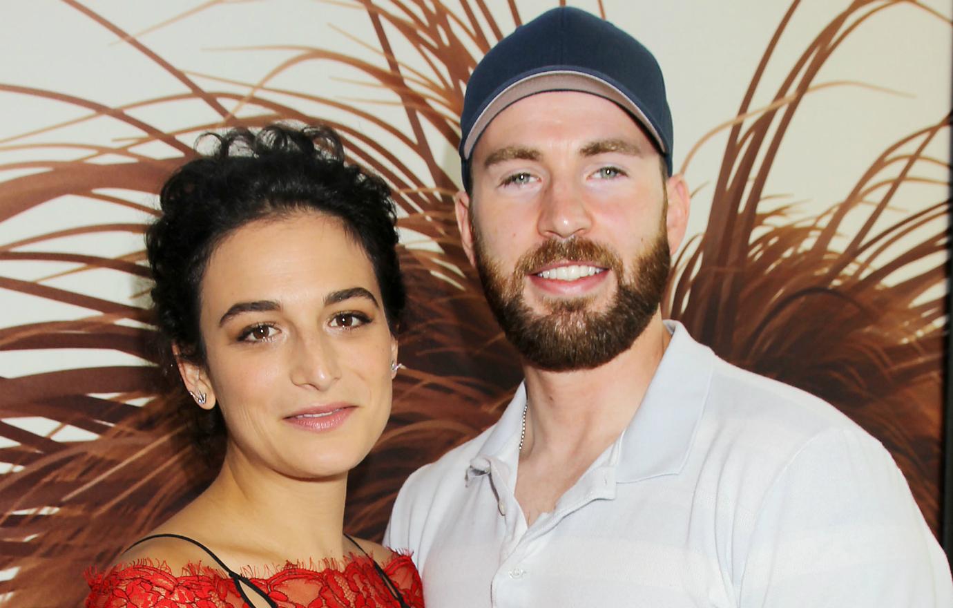 Jenny Slate, who wore a red lace dress, and Chris Evans, who sported a white collared shirt sleeve shirt, appeared at the premiere of The Secret Life of Pets.