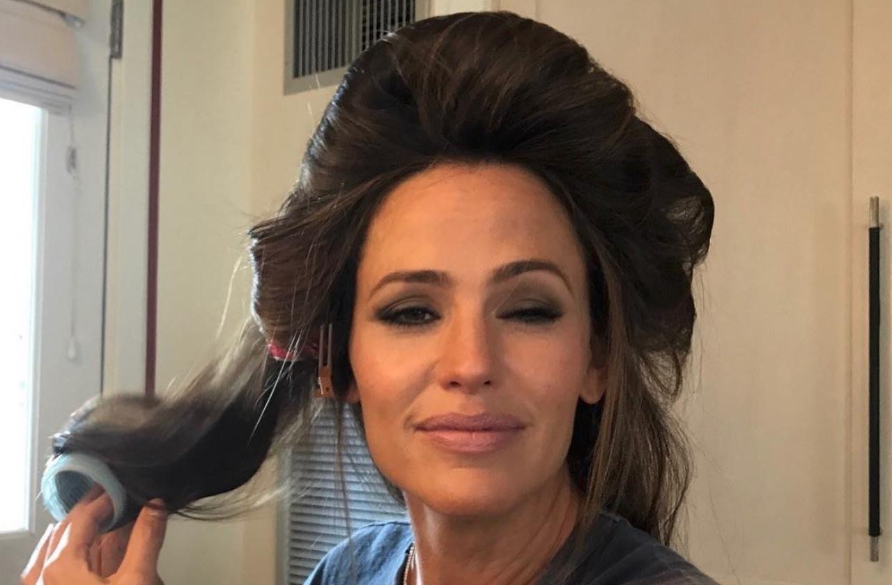 A Selfie of Jennifer Garner with her hair in curlers and eyes squinting