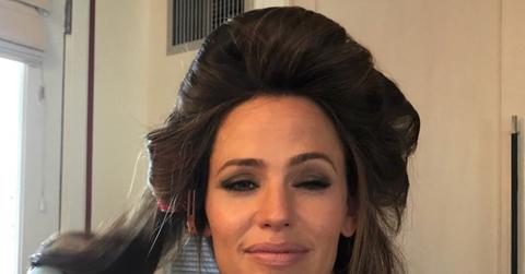 A Selfie of Jennifer Garner with her hair in curlers and eyes squinting