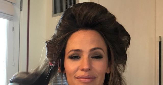 A Selfie of Jennifer Garner with her hair in curlers and eyes squinting