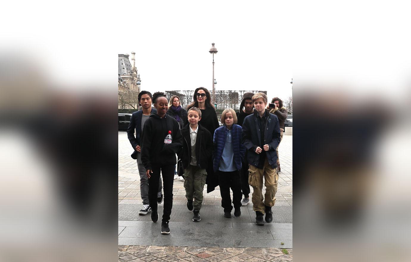 //angelina jolie kids play paris dad brad pitt home