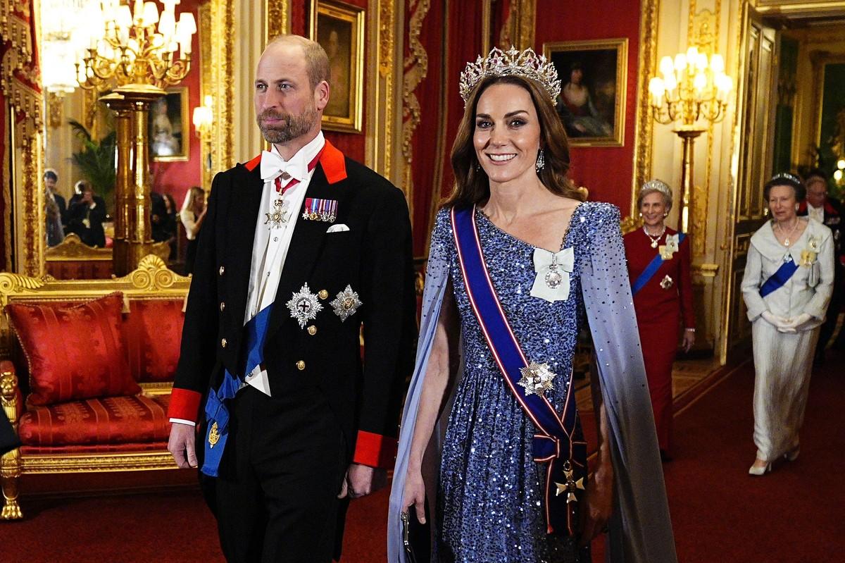 A source claimed Markle believes Prince William and Princess Kate are treated differently for sharing family images than she and Prince Harry are.