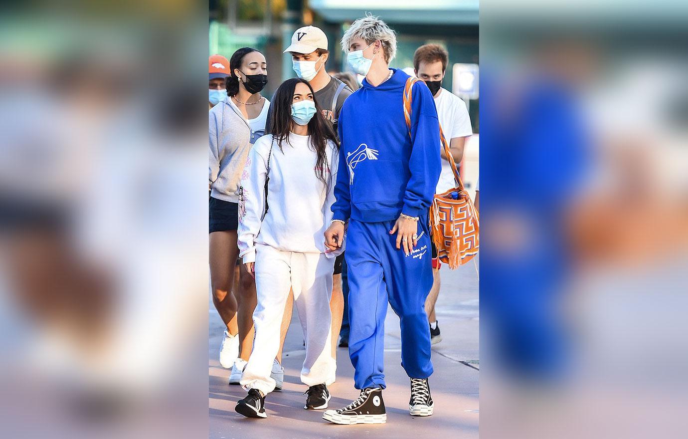 megan fox and boyfriend machine gun kelly visit disneyland with her parents and family in anaheim