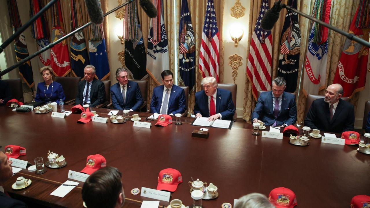 Trump and McMahon seated with officials at a White House meeting