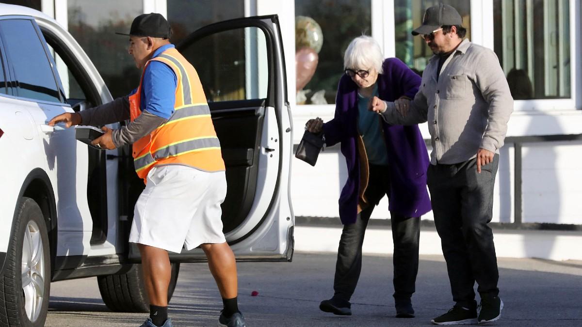 image of The 'Terms of Endearment' wore a royal purple sweater.