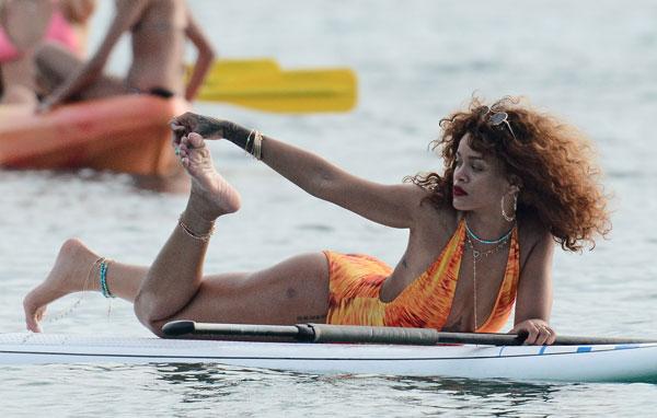 //rihanna swimsuit paddleboarding photos