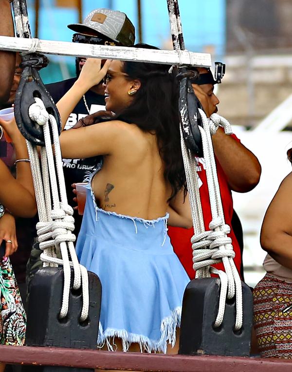 Braless Rihanna Spills Major Side Boob In Barbados