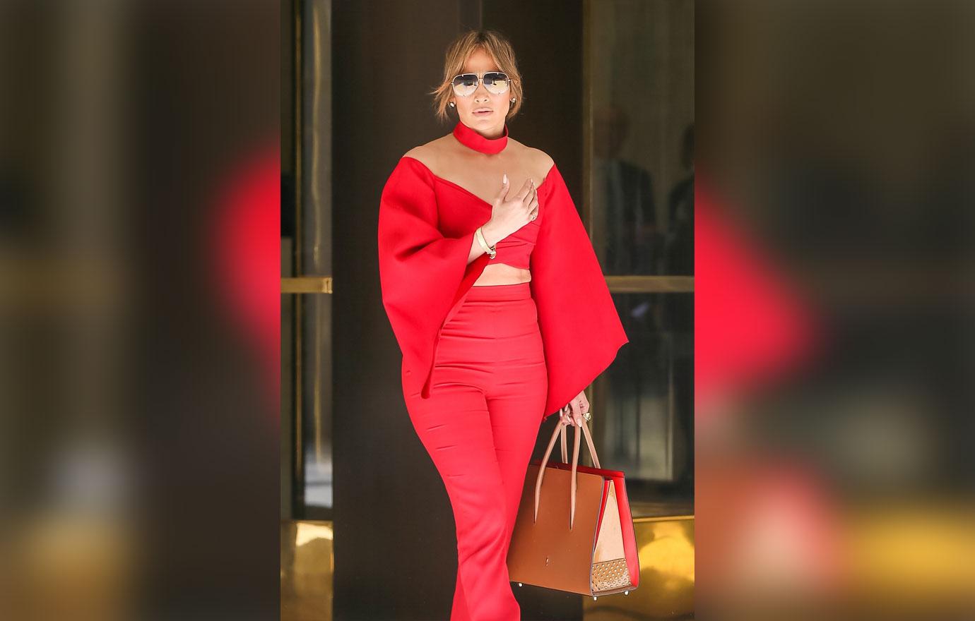 //jennifer lopez alex rodriguez holding arms red shirt boobs pants