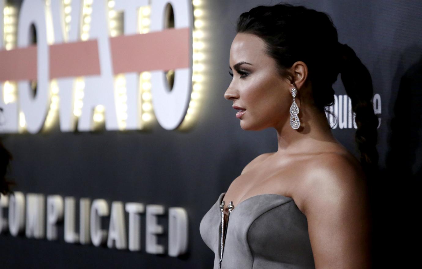 Demi Lovato modeled a grey, valour-like fabric dress on a recent red carpet.