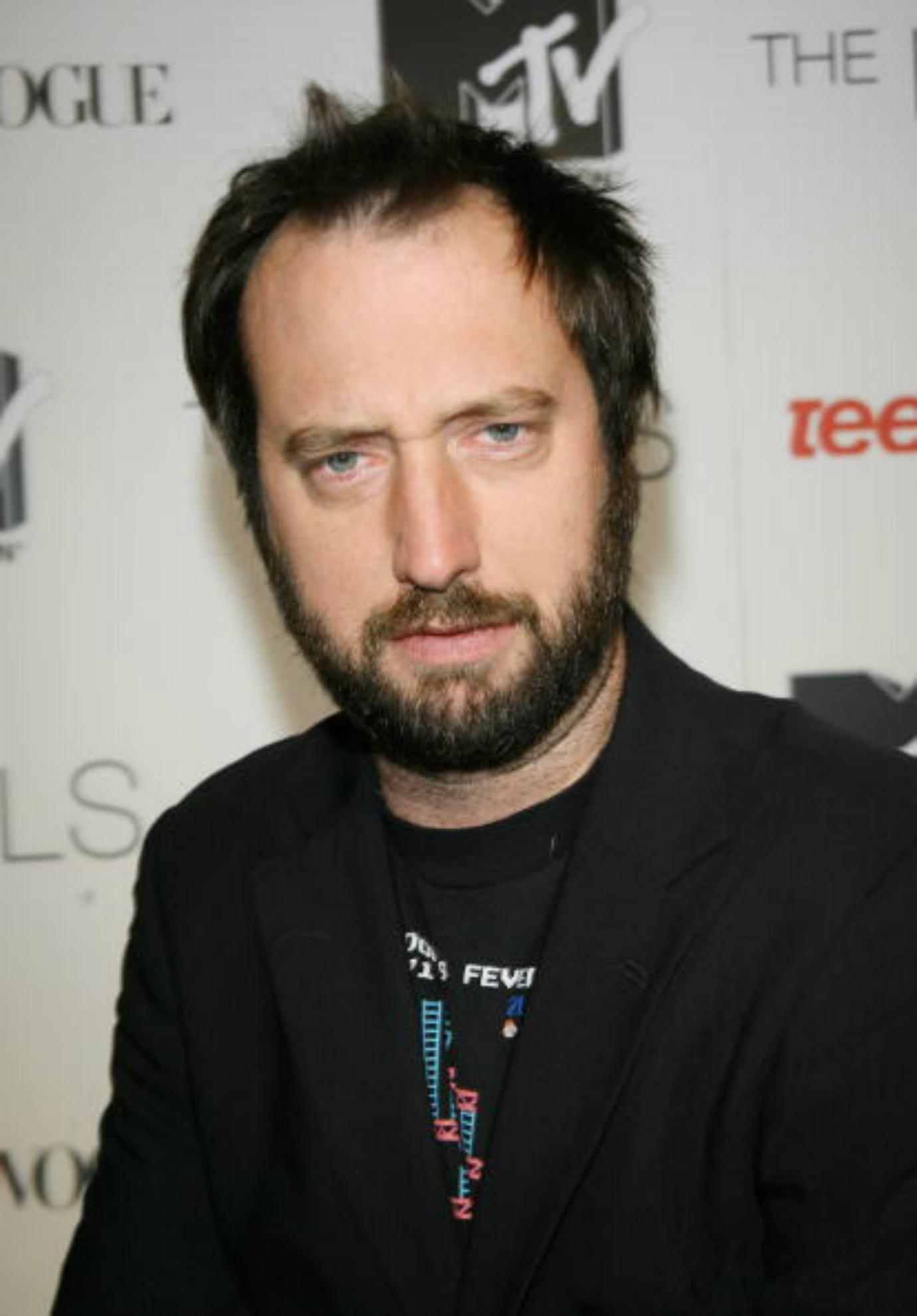 Tom Green poses on the red carpet.