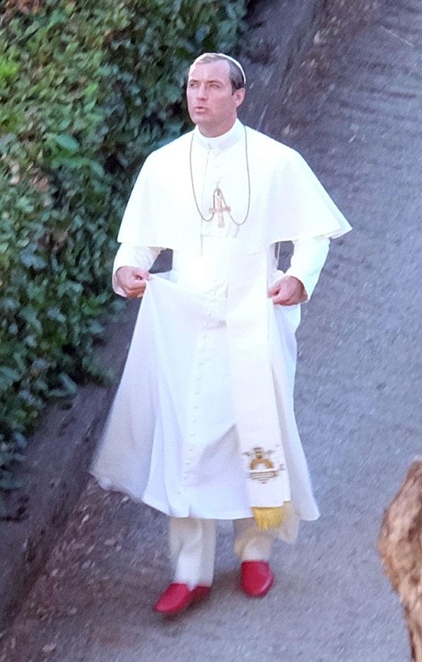 //jude law smokes cigarette dressed up as pope