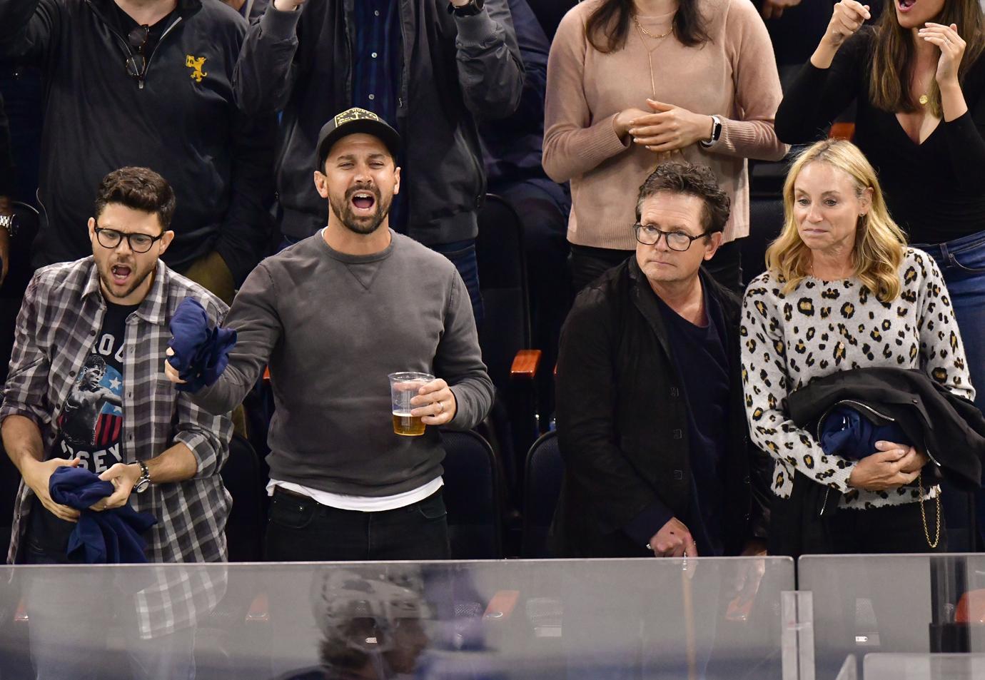 Michael J. Fox & Wife Tracy Pollan Attend Hockey Game Following Drinking Binge Admission