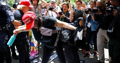 Trump Fan Smothers Pro-Biden Rival With Her Chest Ahead of Bombshell