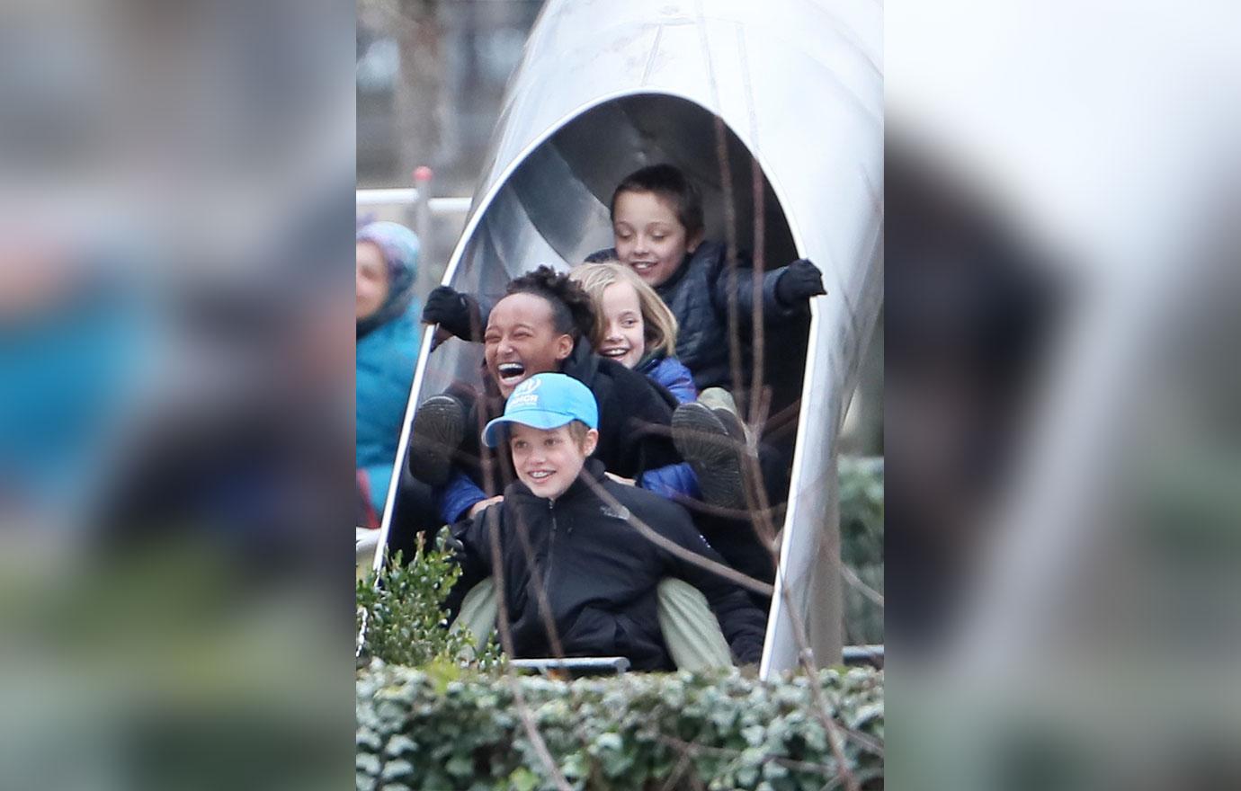 //angelina jolie kids play paris dad brad pitt home