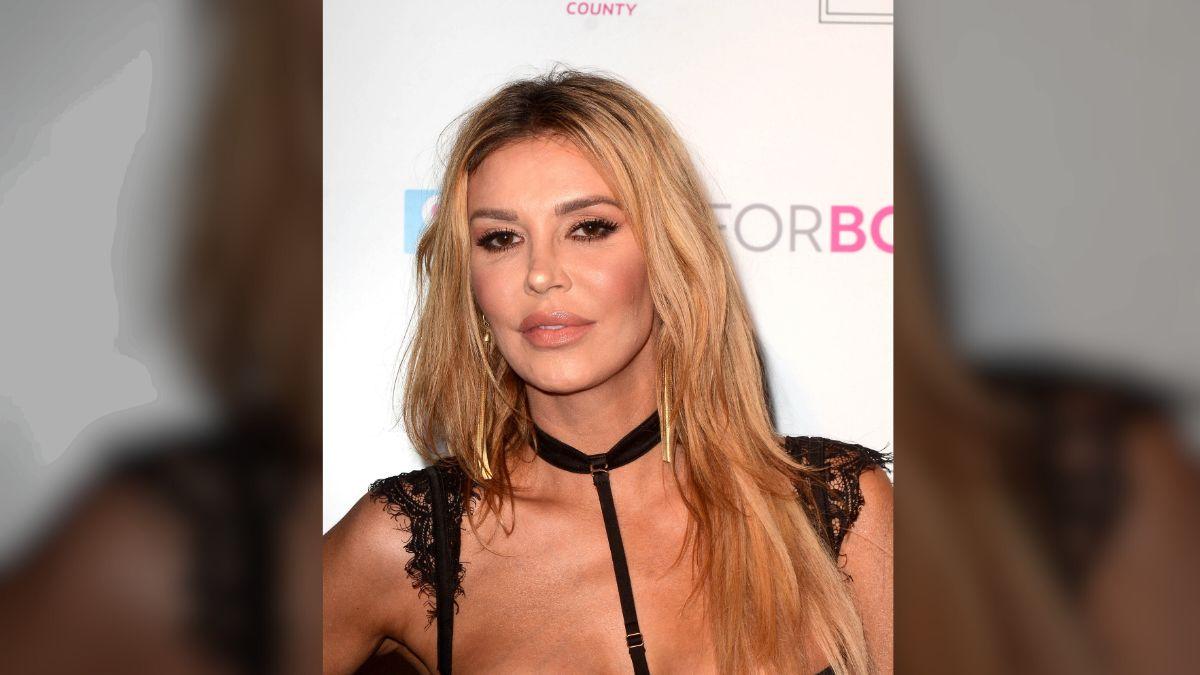 The 'Traitors' alum said a sonogram revealed a ruptured implant and leaking silicone in her lymph nodes, prompting urgent removal.