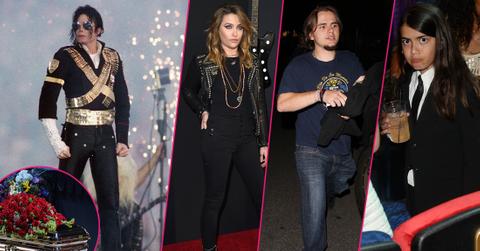 Michael Jackson wears a black jacket with three gold bands around him. Paris Jackson, Prince Jackson, Blanket Jackson are insetted on the left hand side of the image. A shot of Michael Jackson has been inset in the bottom left corner.