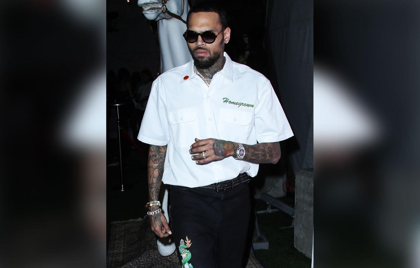 chris brown no charges battery la mansion woman weave smacked off