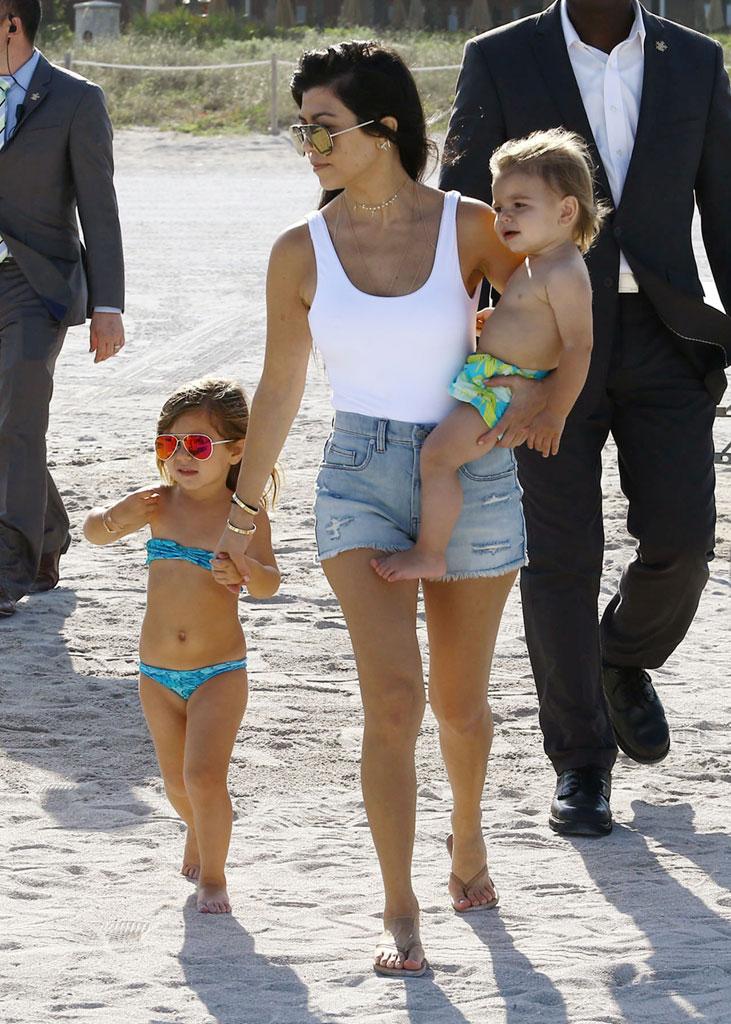 //kourtney kardashian swimsuit pool kids baby reign