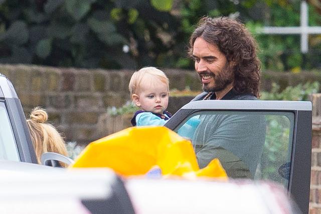 Russell Brand Shows Off His Sweet Side, Cradles Baby Girl During Family ...