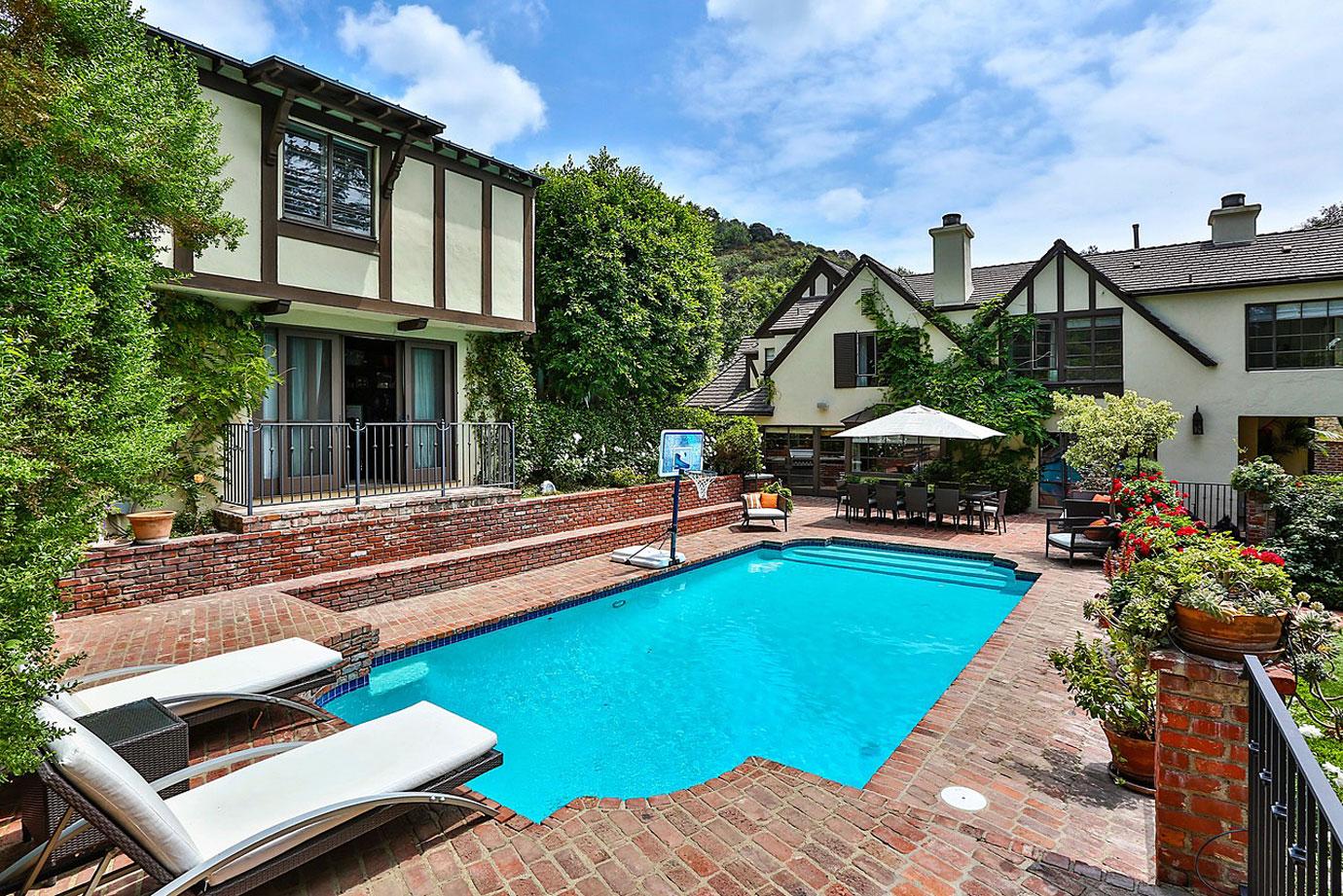 rihanna buys  million beverly hills home next door mansion