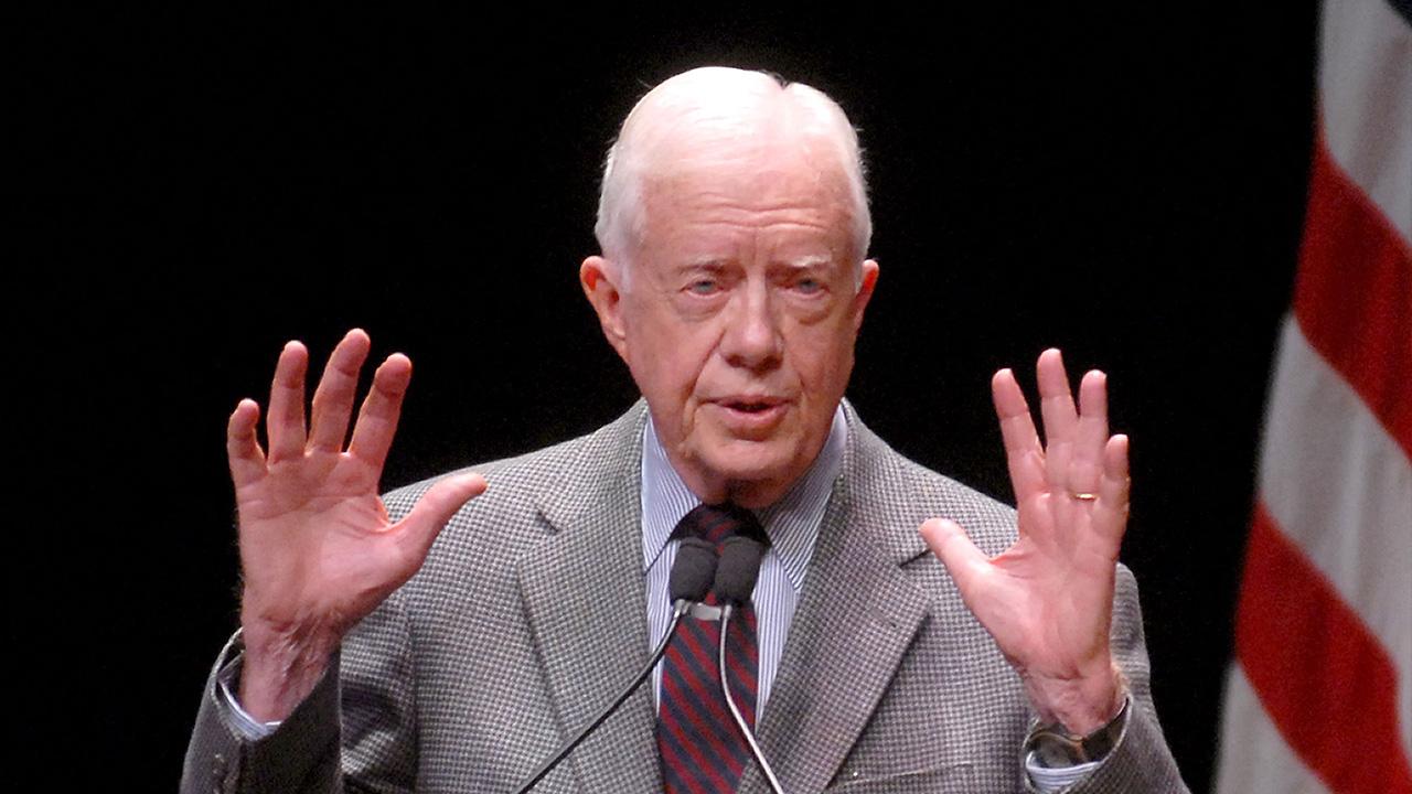 Jimmy Carter denied kissing the Queen Mother on the lips.