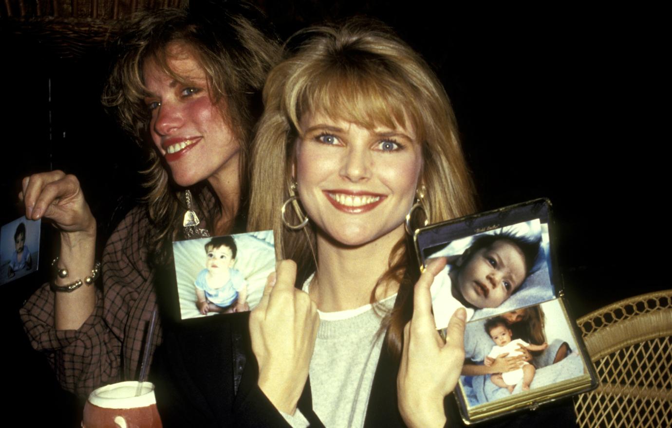 At a movie premiere party, model Christie Brinkley and singer Carly Simon exchanged snapshots of their kids.