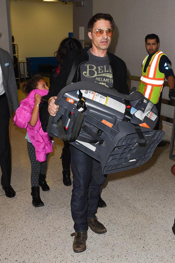 //olivier martinez pushes airport worker