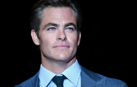 Chris Pine was piercing in a blue-grey suit at the premiere of Outlaw King, a movie That found him doing full frontal nudity.