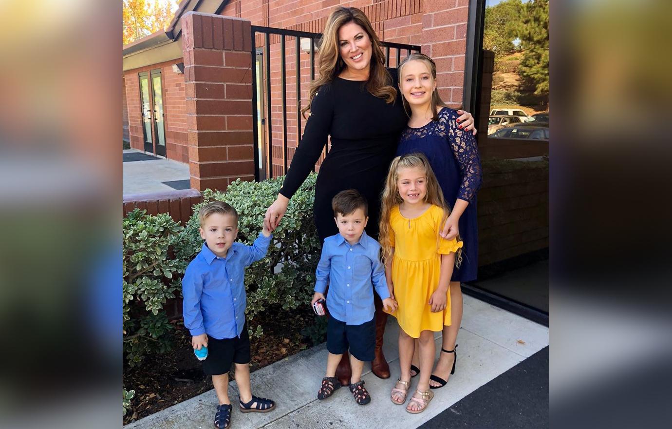 Emily Simpson Poses Smiling With Four Children