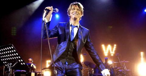 David Bowie performs on stage.