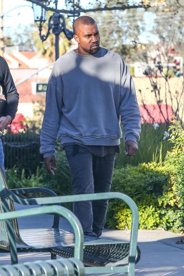 //kanye west caught checking out womans butt​