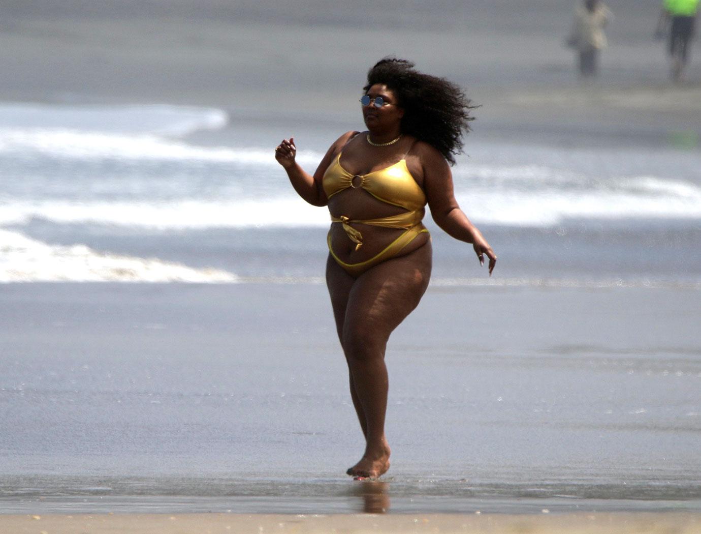 Lizzo Shows Off Curves In Gold Bikini During Beach Day: Photos