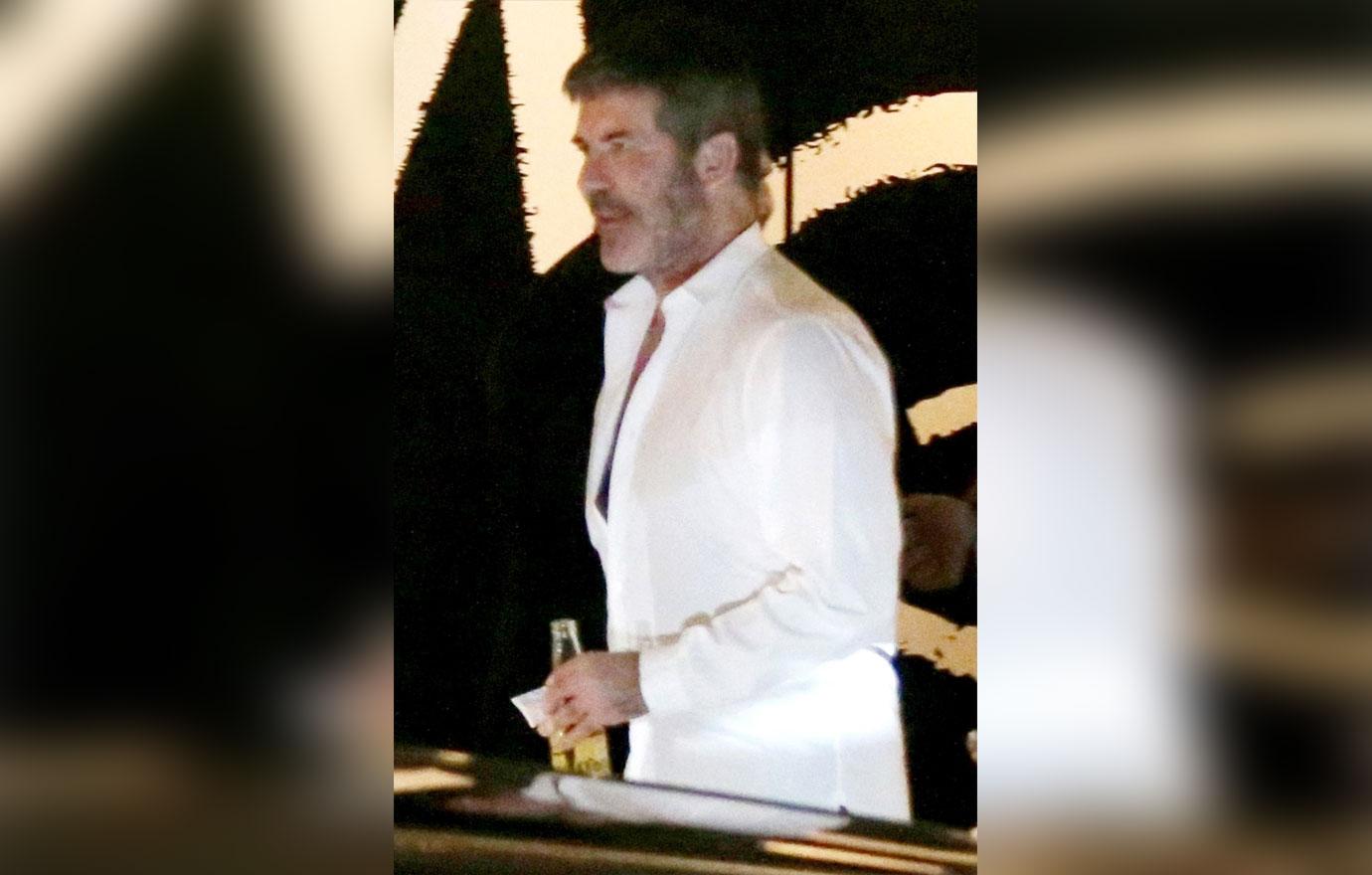 //Simon Cowell drinking after hospital