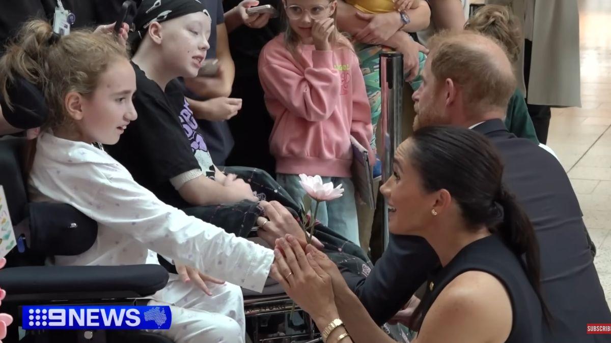 Markle wore pricey gold jewelry to meet with children's cancer patients. 