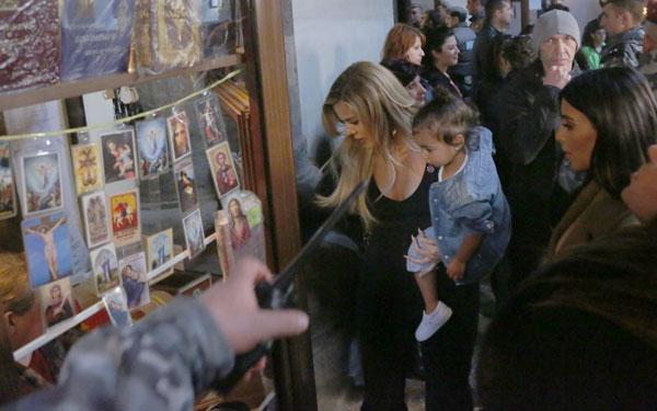 Kim & Khloe Kardashian Light A Candle In Armenia With North West