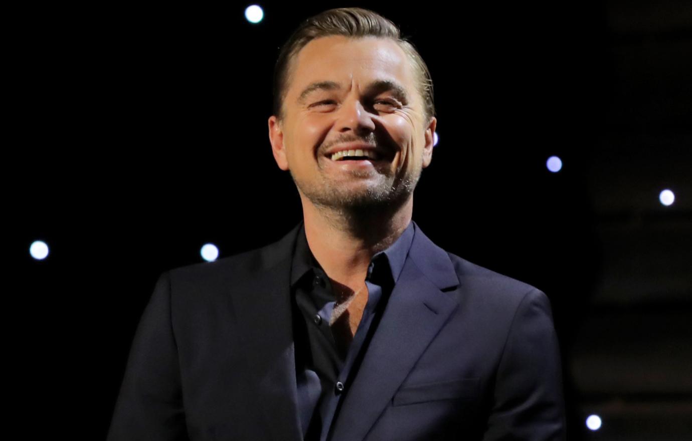 Leonardo DiCaprio was all smiles in a black suit, sans tie, at a recent event.