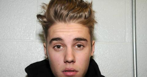 In this handout photo provided by Miami-Dade Police Department, pop star Justin Bieber poses for a booking photo at the Miami-Dade Police Department on January 23, 2014 in Miami, Florida. Justin Bieber was charged with drunken driving, resisting arrest and driving without a valid license after Miami Beach Police found the pop star street racing on Thursday morning.