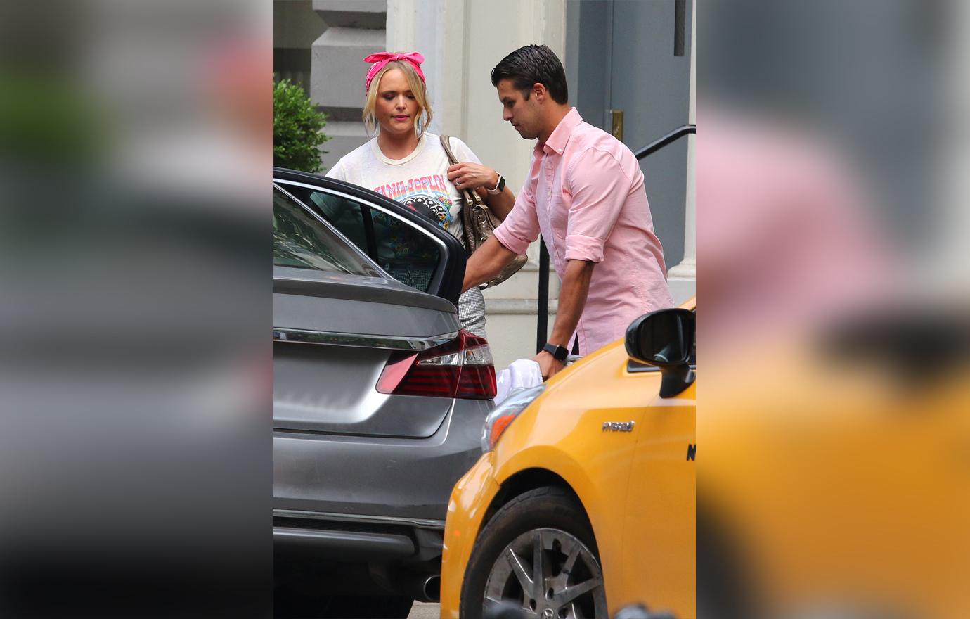 Miranda Lambert and Husband Brendan McLoughlin Seen Walking Holding Hands Outside In Matching Pink and Denim Outfits