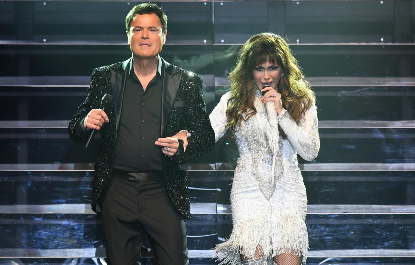 Donny Osmond and Marie Osmond perform during the Donny & Marie Show at the Hard Rock Events Center held at the Seminole Hard Rock Hotel & Casino