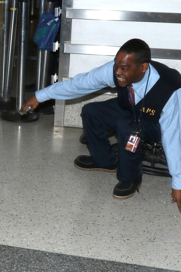 //olivier martinez pushes airport worker