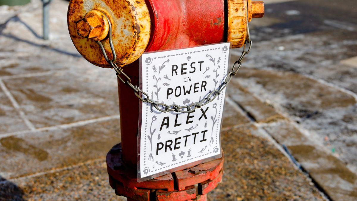 image of a fire hydrant with a sign that reads 'Rest in Power Alex Pretti'