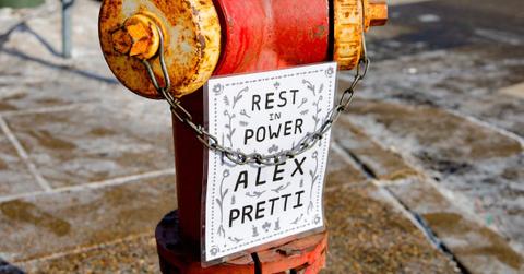 image of a fire hydrant with a sign that reads 'Rest in Power Alex Pretti'