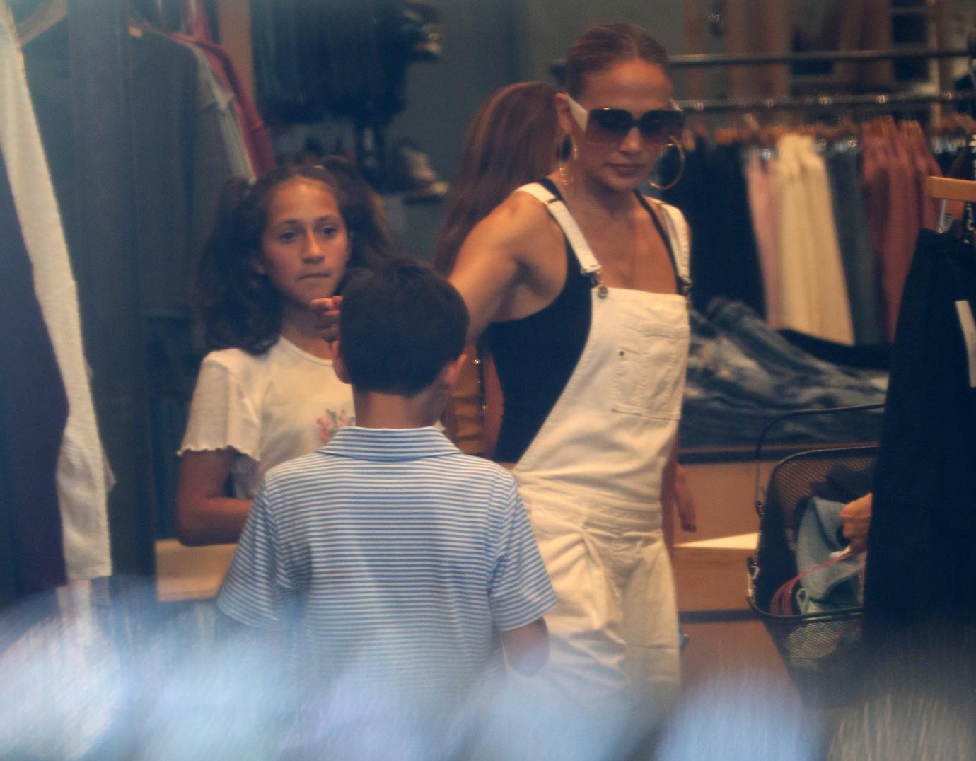 Jennifer Lopez takes her twins Max and Emme shopping at the Lincoln Road Mall in Miami. The group stopped by an Urban Outfitters store to peruse the selection.