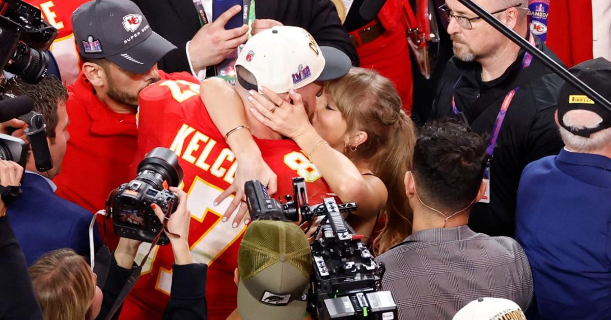 Taylor Swift kisses Travis Kelce after the Kansas City Chiefs won the Superbowl.