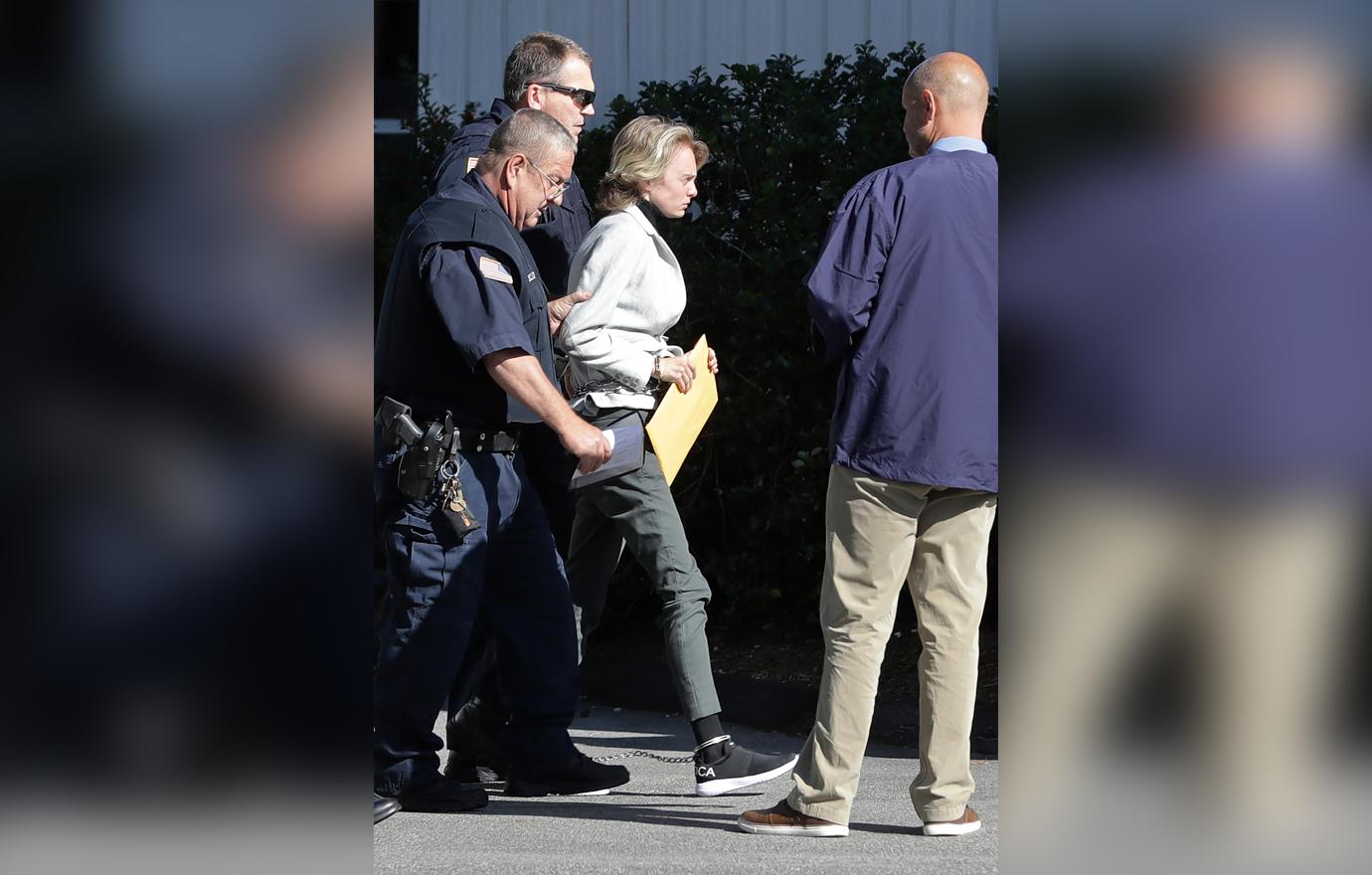 Michelle Carter, center, arrives for a parole hearing on in Natick, Mass.