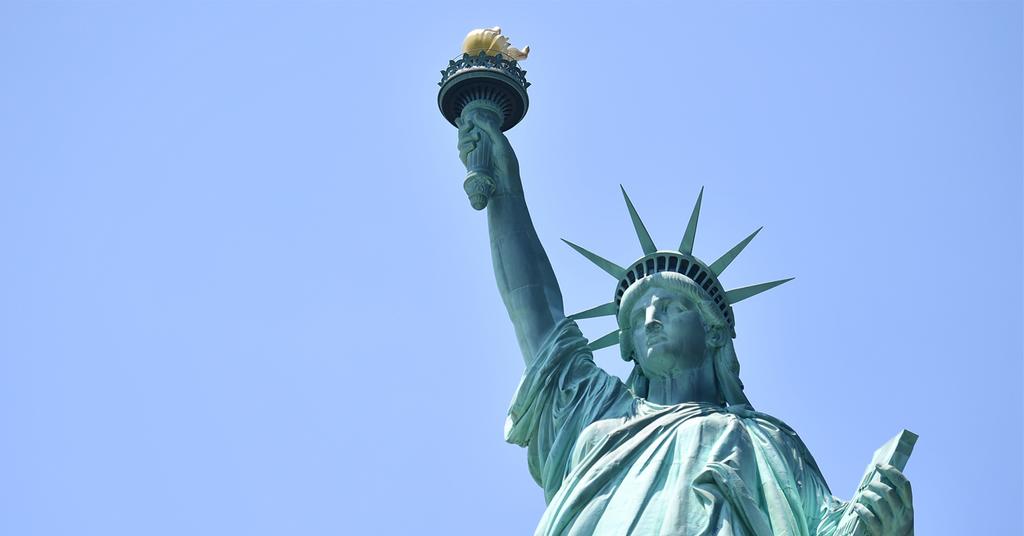 Woman Climbs On Statue Of Liberty In ICE Protest