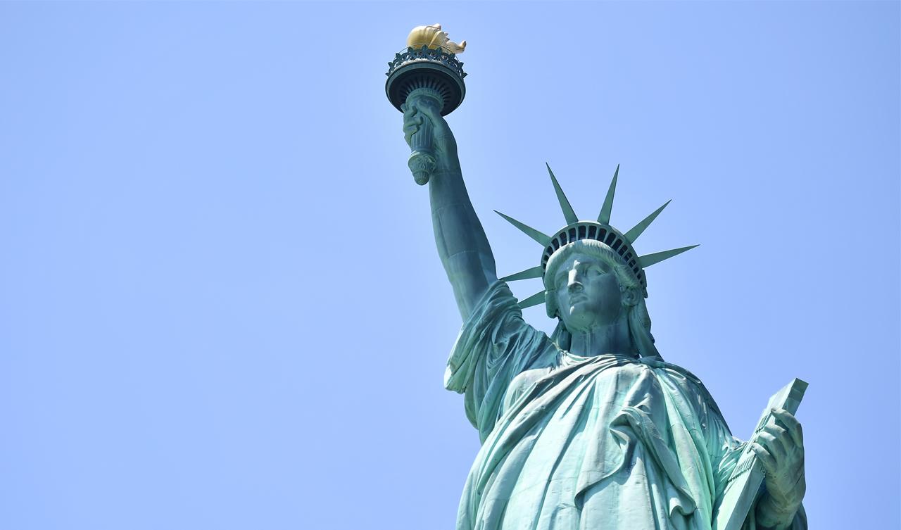 Woman Climbs On Statue Of Liberty In ICE Protest