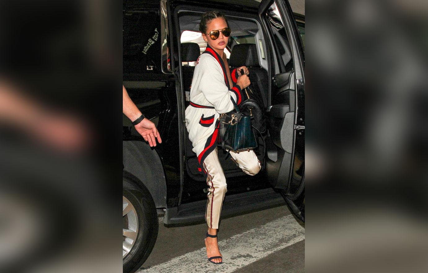 [pics] Chrissy Teigen Suffers Nip Slip In Gucci Robe