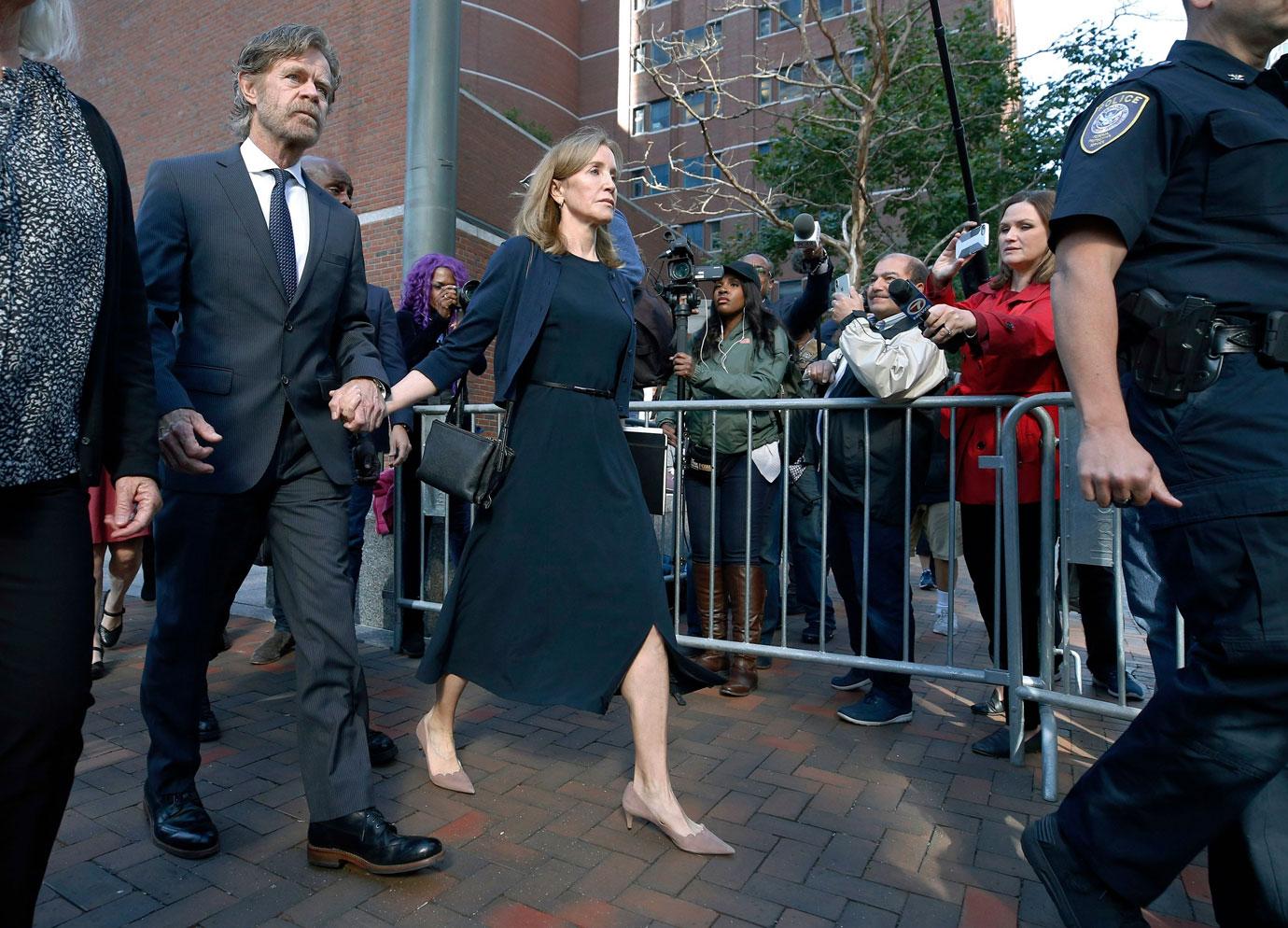 Felicity Huffman leaves federal court with her husband William H. Macy after she was sentenced in a nationwide college admissions bribery scandal, in Boston