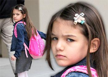 Surly Suri! Tom & Katie’s Little Girl Scowls Going To School